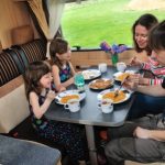 Family Eating Their Meal In The RV