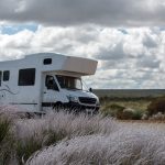 Small RV Traveling Across Road