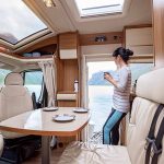 Woman standing in remodeled RV