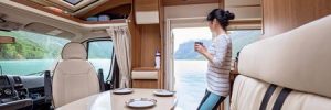 Woman standing in remodeled RV