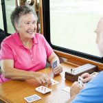 Man and Woman playing card games on Rv road trip